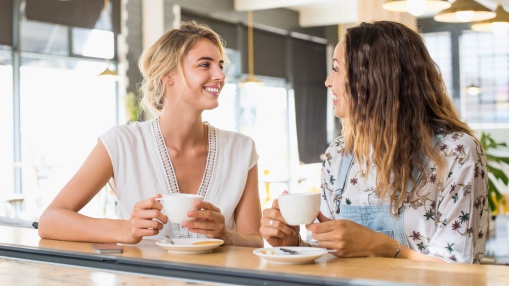 two women talking in coffee shop
